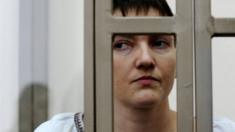 Ukrainian jailed military officer Nadiya Savchenko stands in a glass cage during a trial in the town of Donetsk, Rostov-on-Don region, Russia, Thursday, 3 March 2016