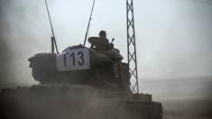 A Turkish tank heads towards the Syrian border, 24 August