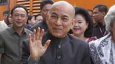 Cambodia's King Norodom Sihamoni and his mother, former queen Monique, at the railway station in Phnom Penh on December 30, 2016.