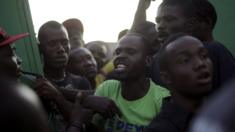 People argue at a voting station in Haiti