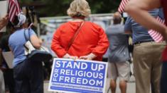 A woman protests at religious freedom rally in Chicago, Illinois