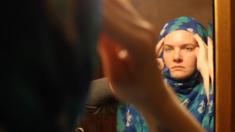 Jessey Eagan adjusts her hijab