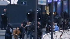 Police rescuing hostages from supermarket, 9 January 2013