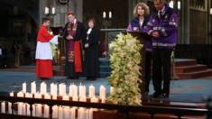 Emergency workers speak during memorial service for Alps crash victims in Cologne Cathedral on 17 April 2015