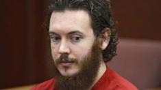 James Holmes with a beard and dark hair