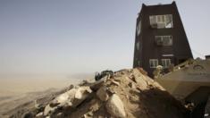 Saudi soldiers look toward the border with Yemen, at a military point in Najran, Saudi Arabia, Tuesday, April 21, 2015.