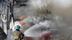 Firemen extinguish a fire in a bus in Guadalajara, Mexico, 01 May 2015