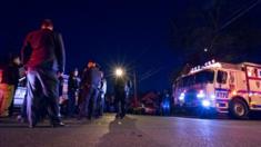 Police work in a neighborhood in the Queens borough of New York on Saturday, May 2, 2015 after an NYPD officer was shot.