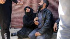 People in shock following reported air strikes by Syrian government forces in Aleppo (17 April 2015)