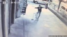 CCTV footage shows man brutally beating young boy in street, Yan'an city, Shaanxi province, China - 04 May 2015