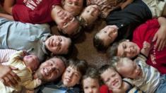 The Schwandt boys welcome their thirteenth brother to the family