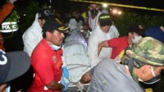 Rescue workers carry the body of one of the miners May 14, 2015