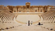 Tourists take pictures at the ancient Palmyra theater in the historical city of Palmyra on 18 April 2008.