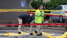 Investigators inspect the crime scene