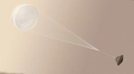 Sonda espacial con paracaídas blanco.