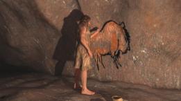 Hombre de la edad de piedra dibujando una pintura rupestre