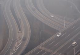 Vehicles run in the heavy smog on 23 December 2015 in Shijiazhuang, Hebei Province of Chin