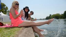 People cooling off by the water's edge