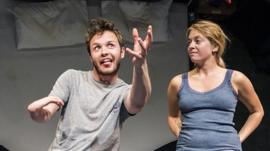 Arthur Hughes and Genevive Barr on stage