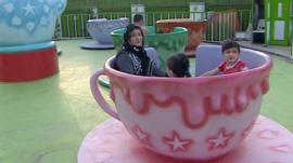 Hosnia Abdullah and children at the fairground