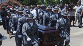 Casket being carried