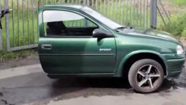 Screenshot of YouTube video of a man sawing possessions in half.