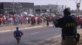 South African Police firing rubber bullets