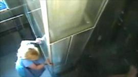 Woman grabs wall as earthquake hits