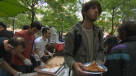 Protester eating pizza in New York