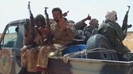 Malian men sat on a truck