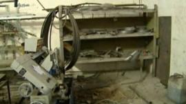 Syrian TV footage of building reportedly damaged in air strike