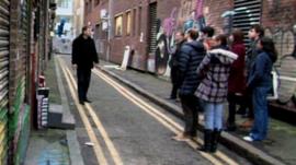 Henri shows his tour group some of London's lesser-known sights
