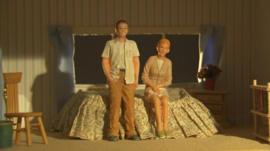 Model figures in a toy bedroom