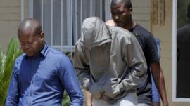 Oscar Pistorius leaves police station