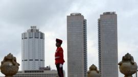 Sri Lankan Army soldiers stand at attention near the Sri Lanka