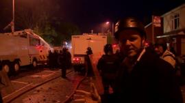 Chris Buckler with riot police
