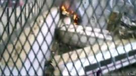 Amateur footage shows train on fire