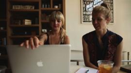 Two women programmers at a computer