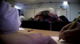 People completing an exam