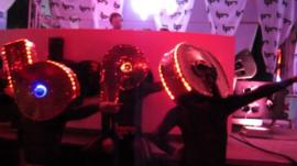 dancers in front of DJ