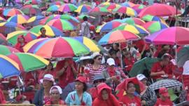 Pro-government supporters with coloured umbrellas in Bangkok