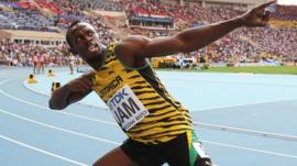 Jamaicas Usain Bolt celebrates after winning the men