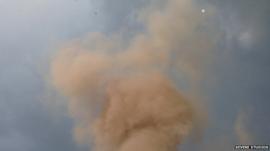 Still from amateur footage shows smoke rising
