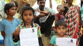 Children holding certificates