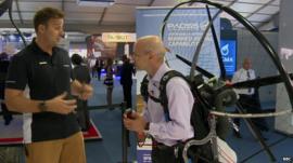 Tom Prideaux-Brune (on the left) and the BBC's Theo Leggett kitted out in a paramotor