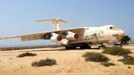 An Ilyushin 76 Russian-made cargo plane, once owned by former arms dealer Victor Bout, sits in a lot on the site of the old Umm Al Quwain airfield.