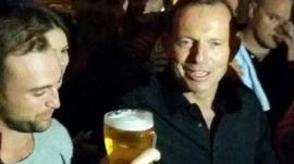 Australian Prime Minister Tony Abbott before downing a pint of beer in Sydney - April 18, 2015