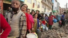 People queuing to receive aid