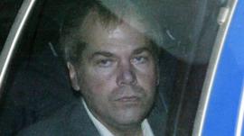 John Hinckley Jr, shown here in 2003, is inside of a car