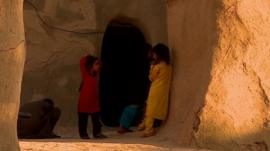 Children outside cave